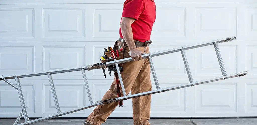 Garage door repair technician arriving with tools and ladder in Indianapolis, IN