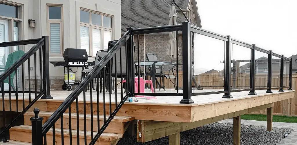 Handrail installation on a deck staircase for safety and code compliance in Indianapolis, IN