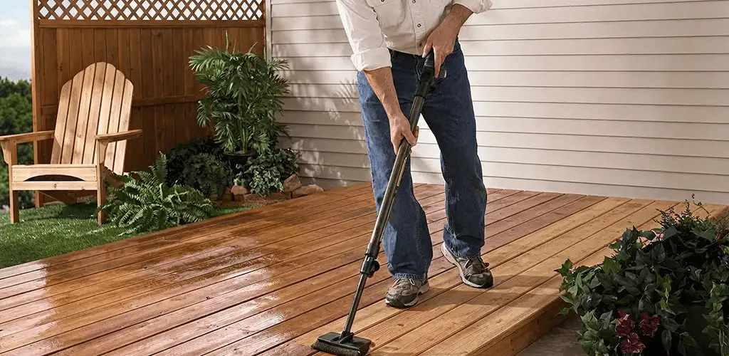 Deck staining service applying stain to a backyard wood deck in Indianapolis, IN